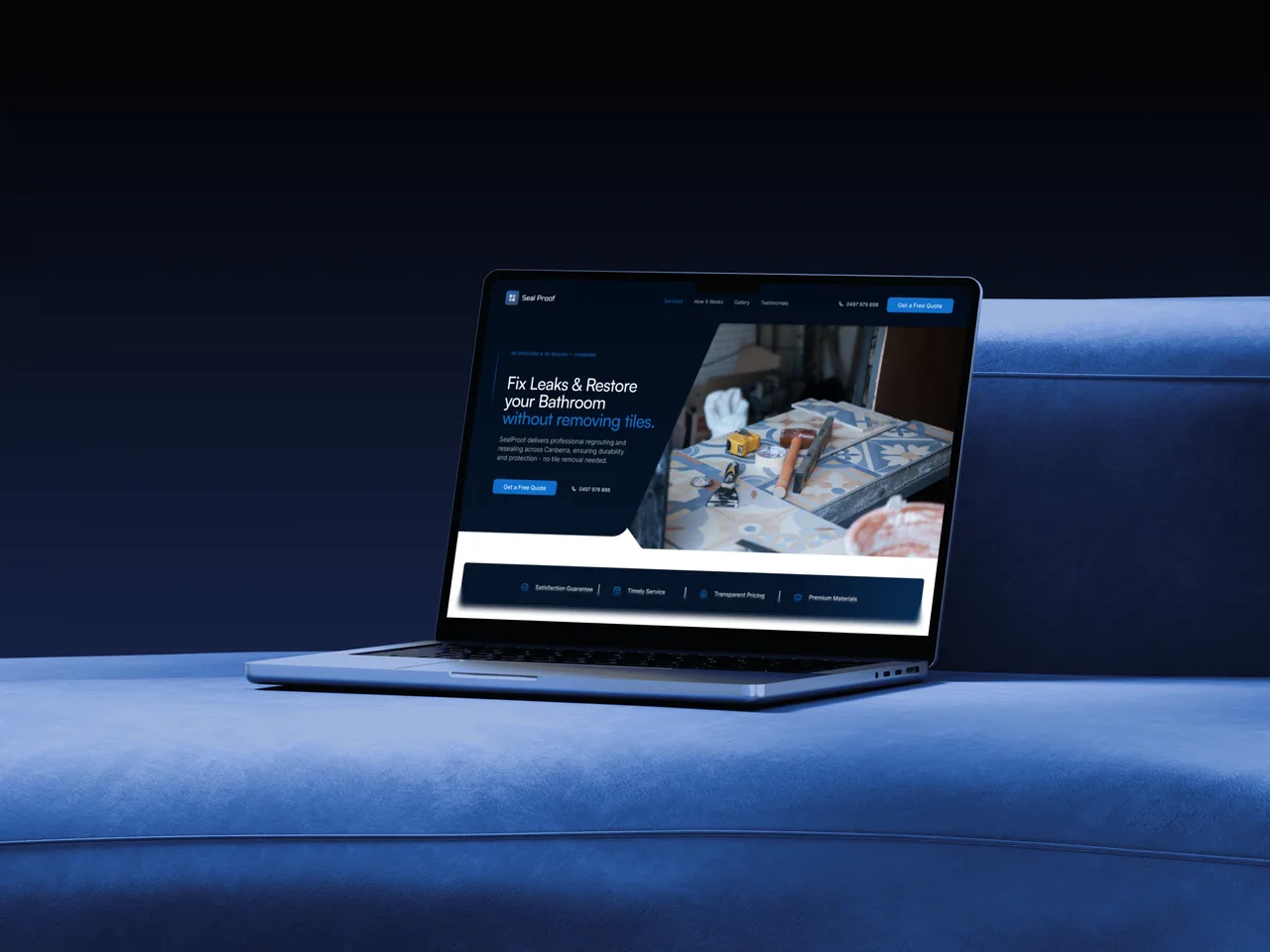 The Seal Proof homepage open on a laptop, sitting on a deep blue sofa in low light